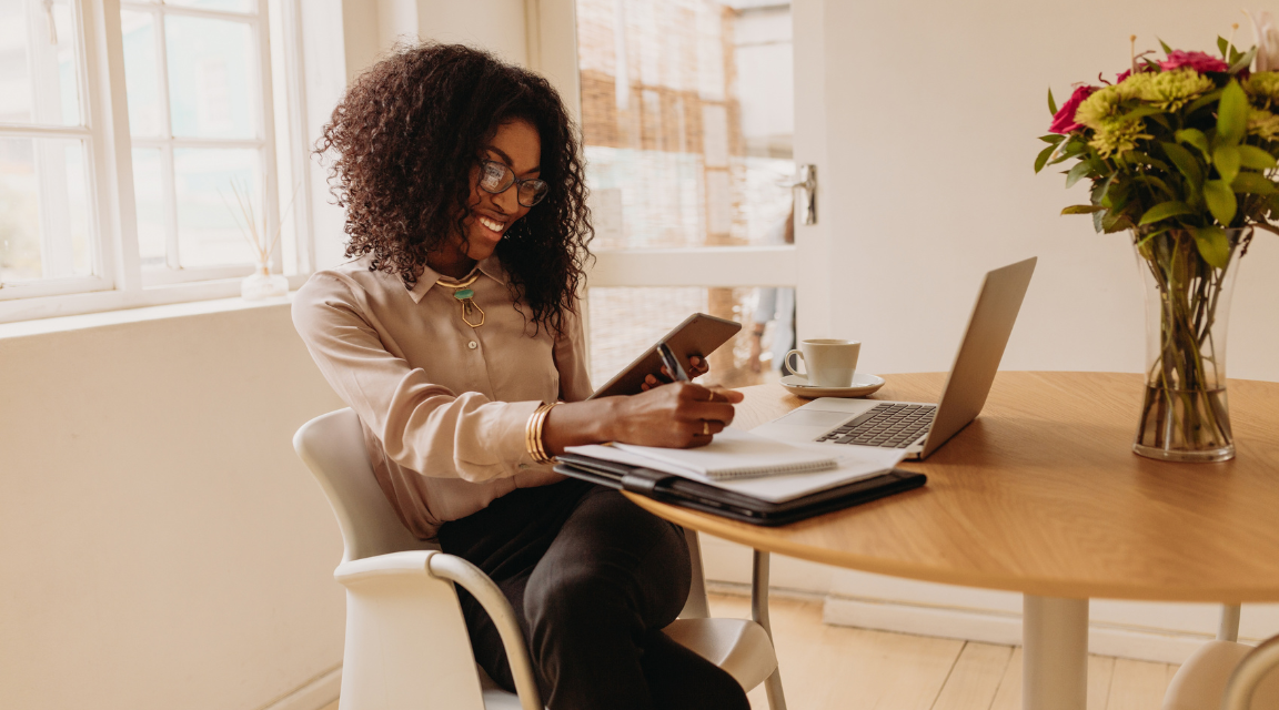 A happy entrepreneur working stress-free with AI automation.