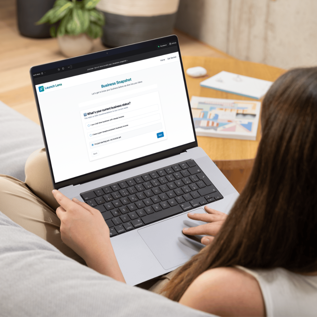 Women sitting with laptop open and using Launch Lens app